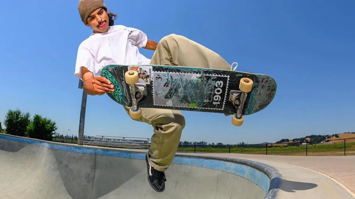 Skater doing a high air out of the concrete bowl at Kennedy Park, Napa
